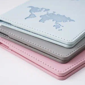 Detail view of map-embossed PU leather passport holders with precision white stitching