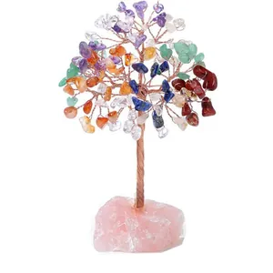 Detailed close-up of handmade crystal tree with multi-color stones and rose quartz base