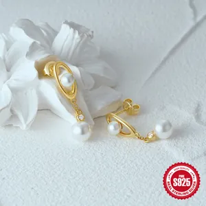 Detailed view of S925 sterling silver drop earrings with white pearls and sparkling zircons