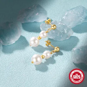 S925 sterling silver drop earrings featuring double white pearls and golden metallic accents
