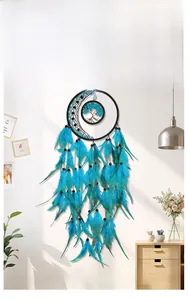Detail of blue feathers and tree of life weaving on black moon dreamcatcher