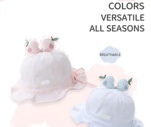 Detail of breathable cotton baby sun hats with pineapple texture and peach accents