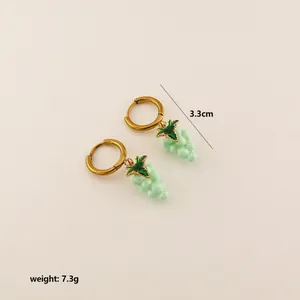 Detail view of grape earrings showing 3.3cm length and 7.3g weight on beige backdrop
