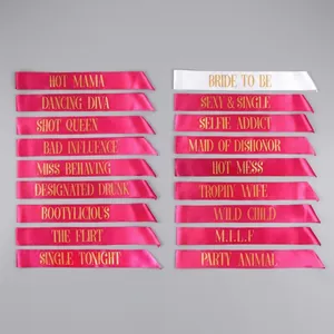 Hot pink and white satin bachelorette party sashes with gold Bride Tribe lettering