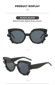 Vue détaillée de lunettes de soleil œil-de-chat noires avec monture dentelée en flamme