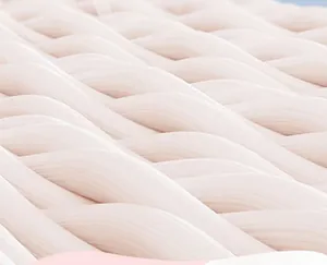 Macro detail of soft pink breathable fabric texture on a baby sun hat for skin comfort