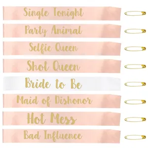 Detail of Bride to Be sash set with gold foil lettering and matching safety pins