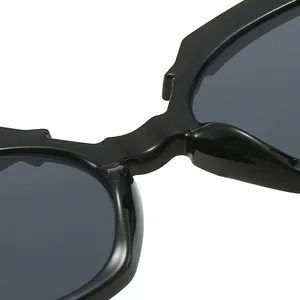 Lunettes de soleil œil de chat chic avec monture géométrique noire pour femmes