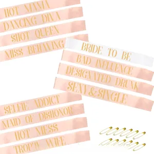 Set of 12 satin bachelorette party sashes with gold foil lettering and safety pins