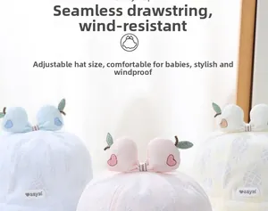 Detail of adjustable baby sun hat with pineapple pattern and soft windproof strap