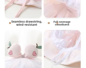 Detail of pink baby sun hat with peach embroidery, soft chin strap and sweatband