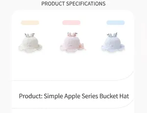 Detailed view of yellow, pink, and blue baby sun hats with cute apple toppers and wavy edges