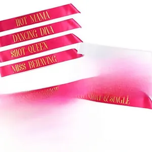 Close-up of pink and white satin bachelorette party sashes with gold Bride to Be lettering