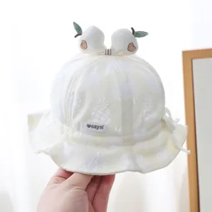 Baby sun hat with pineapple print and white 3D heart-embroidered pom-poms on top