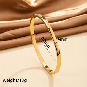 Detail view of 18k gold plated stainless steel bangle with 60mm diameter and 4mm width