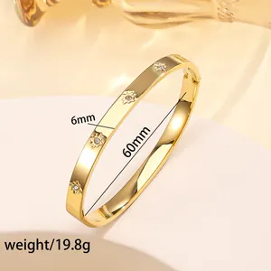 Detailed view of 6mm gold-plated stainless steel star bangle with crystals and dimensions