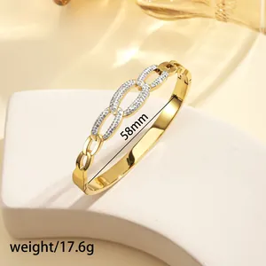 Macro shot of 18k gold plated stainless steel chain bangle with zircon pavé details