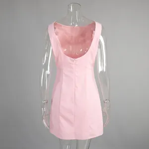 Detailed back view of pink backless mini dress with a hidden zipper closure
