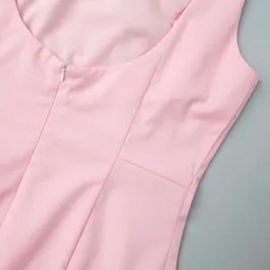 Detail of pink sleeveless dress showing smooth fabric and back invisible zipper closure