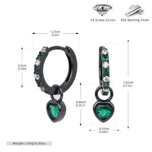 Close-up of S925 silver hoop earrings with heart-shaped green zircon pendants