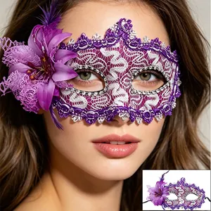 Close-up of purple lace masquerade mask with flower petals and crystal details