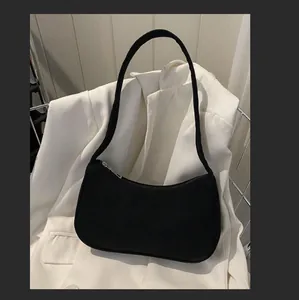 Classic black corduroy baguette bag with minimalist retro design for shoulder carry