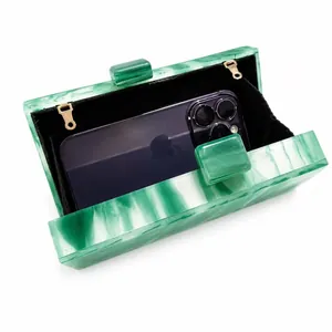 Green marble pattern acrylic clutch bag with chain strap shown with internal phone storage