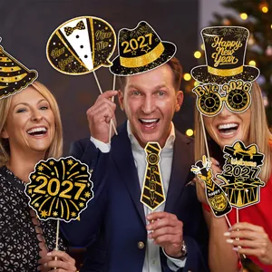 Detail of 2027 New Year party photo booth props with black and gold glitter finish