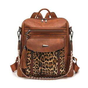 Detail view of brown PU leather backpack with leopard print and ethnic pattern strap