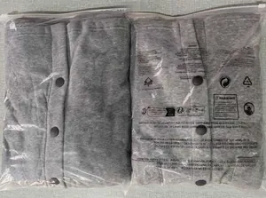 Men's grey knit jacket neatly folded in protective plastic packaging for delivery