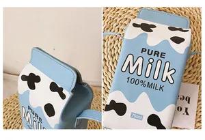 Detail of creative milk box crossbody bag with cow print and 100% milk text on PU leather