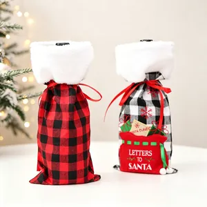 Detail of Christmas wine bottle covers with plaid patterns and white faux fur trim decor