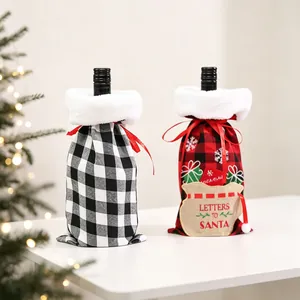 Detail of Christmas wine bottle covers with buffalo plaid pattern and faux fur trim