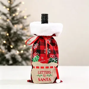 Detail of buffalo plaid wine bottle bag with Letters to Santa embroidery and fur trim