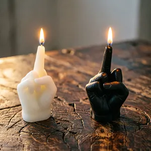 Detailed view of middle finger candles showing realistic hand texture and bright flame