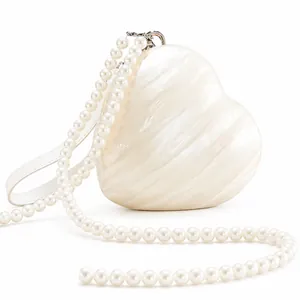 Elegant heart-shaped acrylic evening bag with ivory marble texture and pearl chain