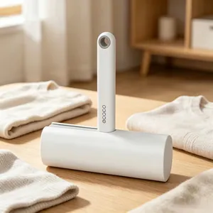 Close-up of ergonomic lint roller with hanging hole on a folded sweater