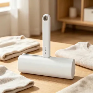 Ivory white lint roller for clothes on a wooden table with soft home background