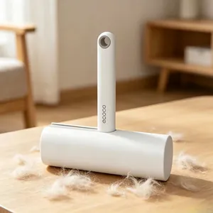 Ecoco handheld lint roller with white adhesive paper for pet hair removal on wood