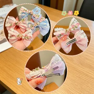 Lace bow hair clips set with pearls and embroidery for girls shown in multiple angles