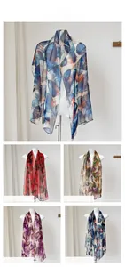 Detail of five lightweight chiffon scarves with leaf patterns and abstract prints