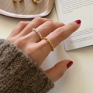 925 sterling silver chain link knot rings in gold and silver finish worn on fingers