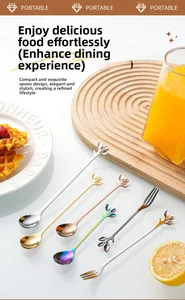 Macro shot of stainless steel spoon and fork with leaf-shaped handles on a wooden tray