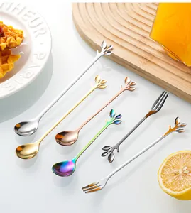 Detail of leaf-shaped stainless steel spoons and forks in gold and multiple colors