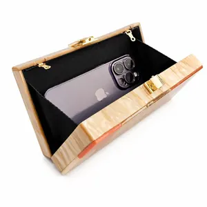 Marbled acrylic evening clutch bag with gold clasp and black lining for large phones