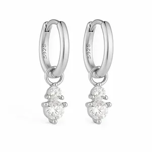 Macro detail of S925 sterling silver hoop earrings with two prong-set cubic zirconia stones