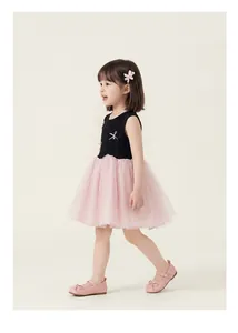 Detail of girls' sleeveless tulle dress with black bodice and pink mesh tutu skirt