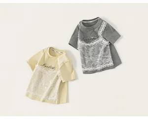 Detail of girls' short-sleeve T-shirts with lace patchwork and bow accents