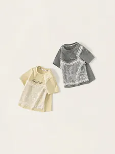 Girls' short sleeve T-shirt with lace embroidery and brand text in yellow and grey colors
