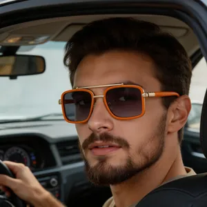 Detailed view of orange square polarized sunglasses with golden double bridge in a car